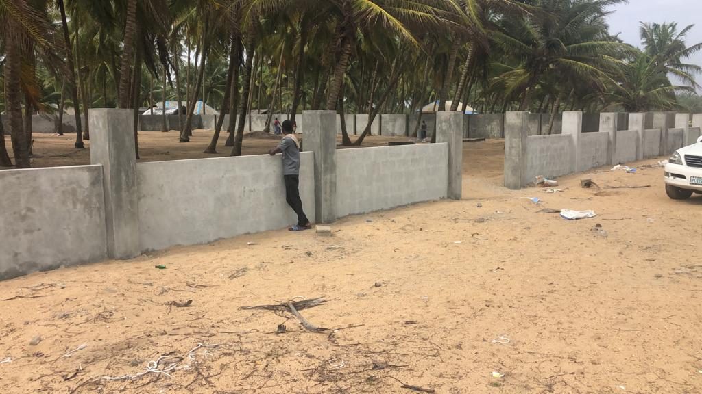 A new concrete boundary wall enclosing the Villas at Waikiki site